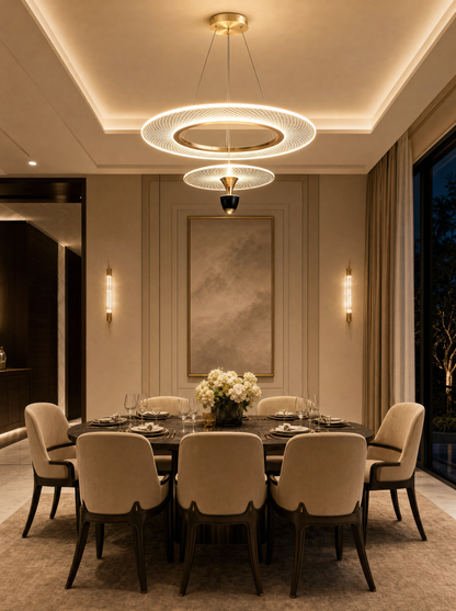 The Milano Designer Chandelier lit above a dining table